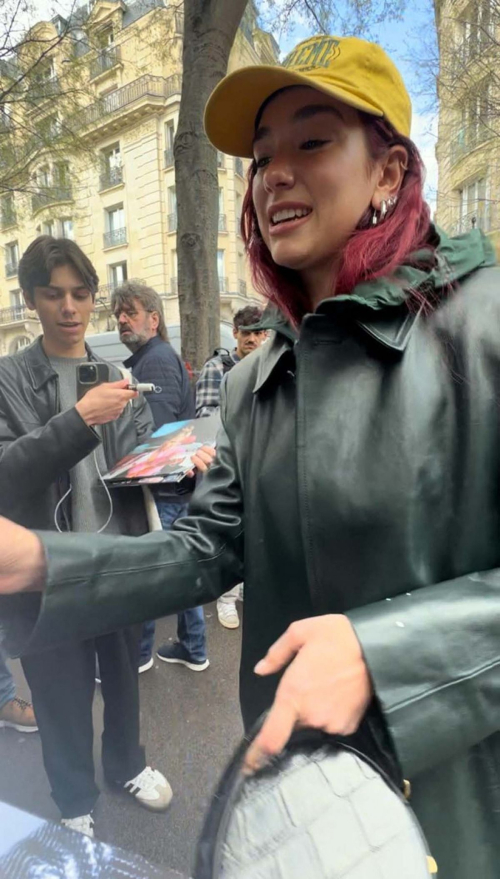 Dua Lipa Signed Autographs for Fans Out in Paris, March 2024