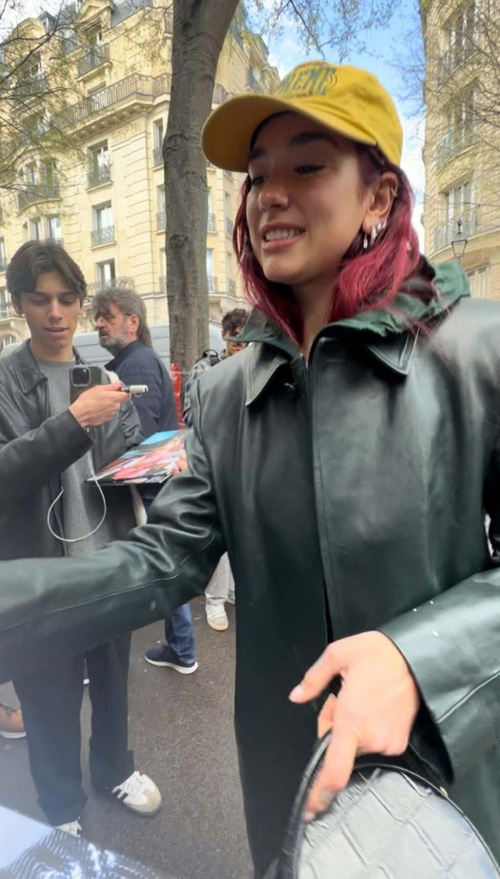 Dua Lipa Signed Autographs for Fans Out in Paris, March 2024 1