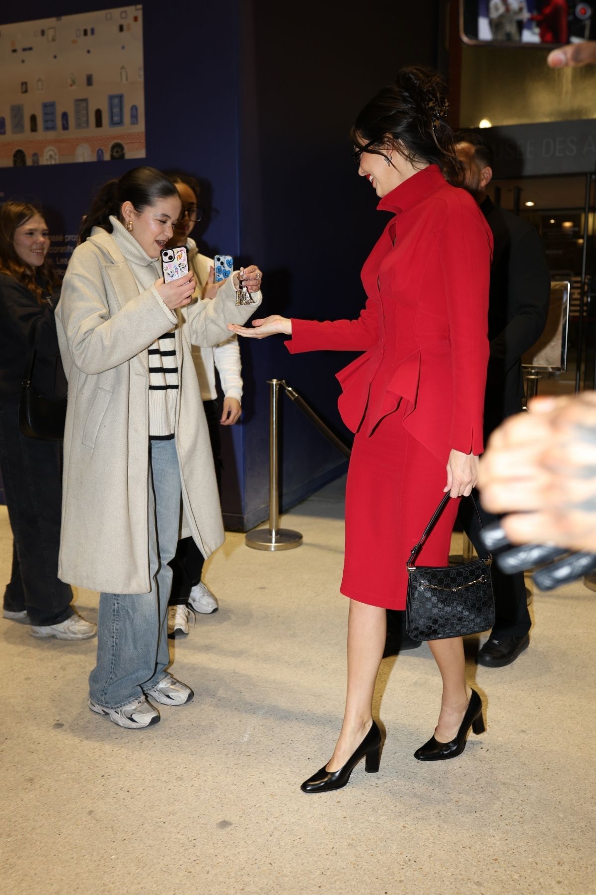 Kendall Jenner Receives Eiffel Tower Keychain Souvenir in Paris, March 2024