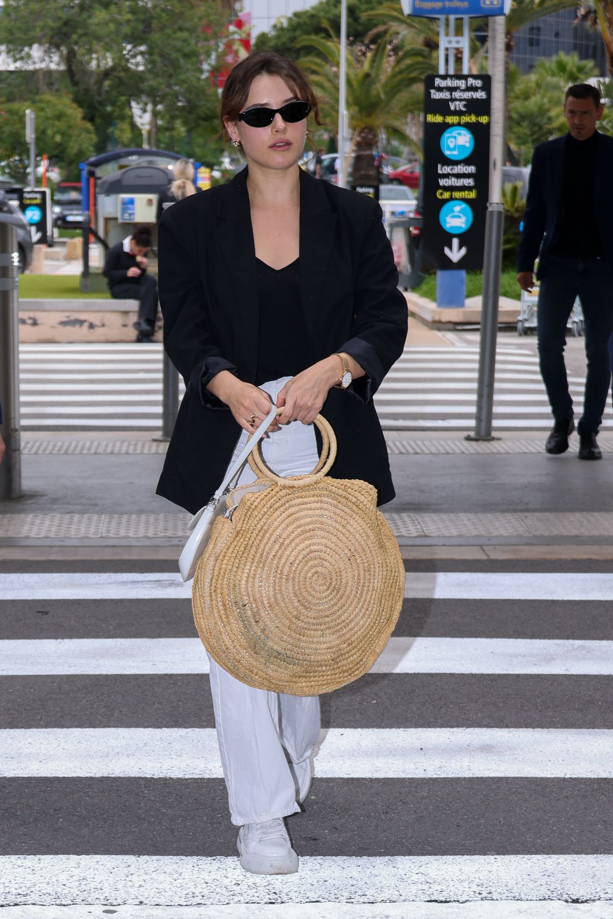 Katherine Langford Leaves 77th Cannes Film Festival at Nice Airport