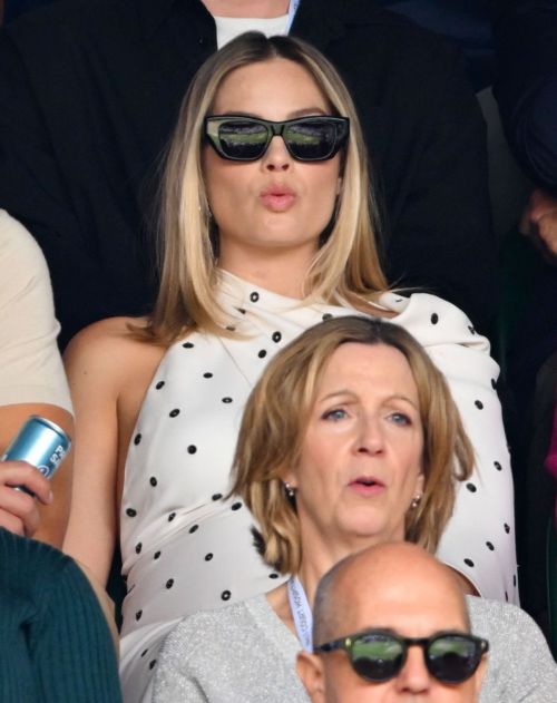 Margot Robbie wears a Dotted Dress at 2024 Wimbledon 2024 in London 2