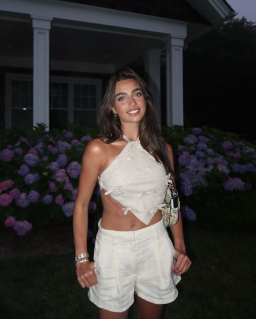 Taylor Nunez in White Top and Shorts at Night in Hamptons at New York, July 2024 1