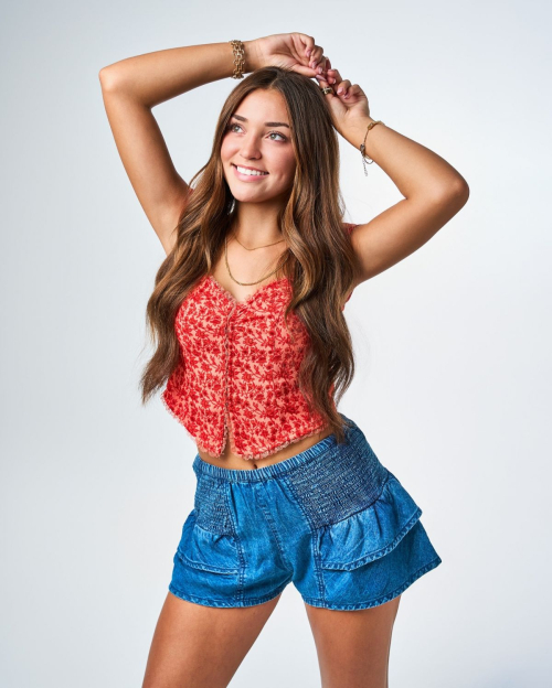 Presley Elise in a Red Top and Denim Short at a Photoshoot, August 2024 2