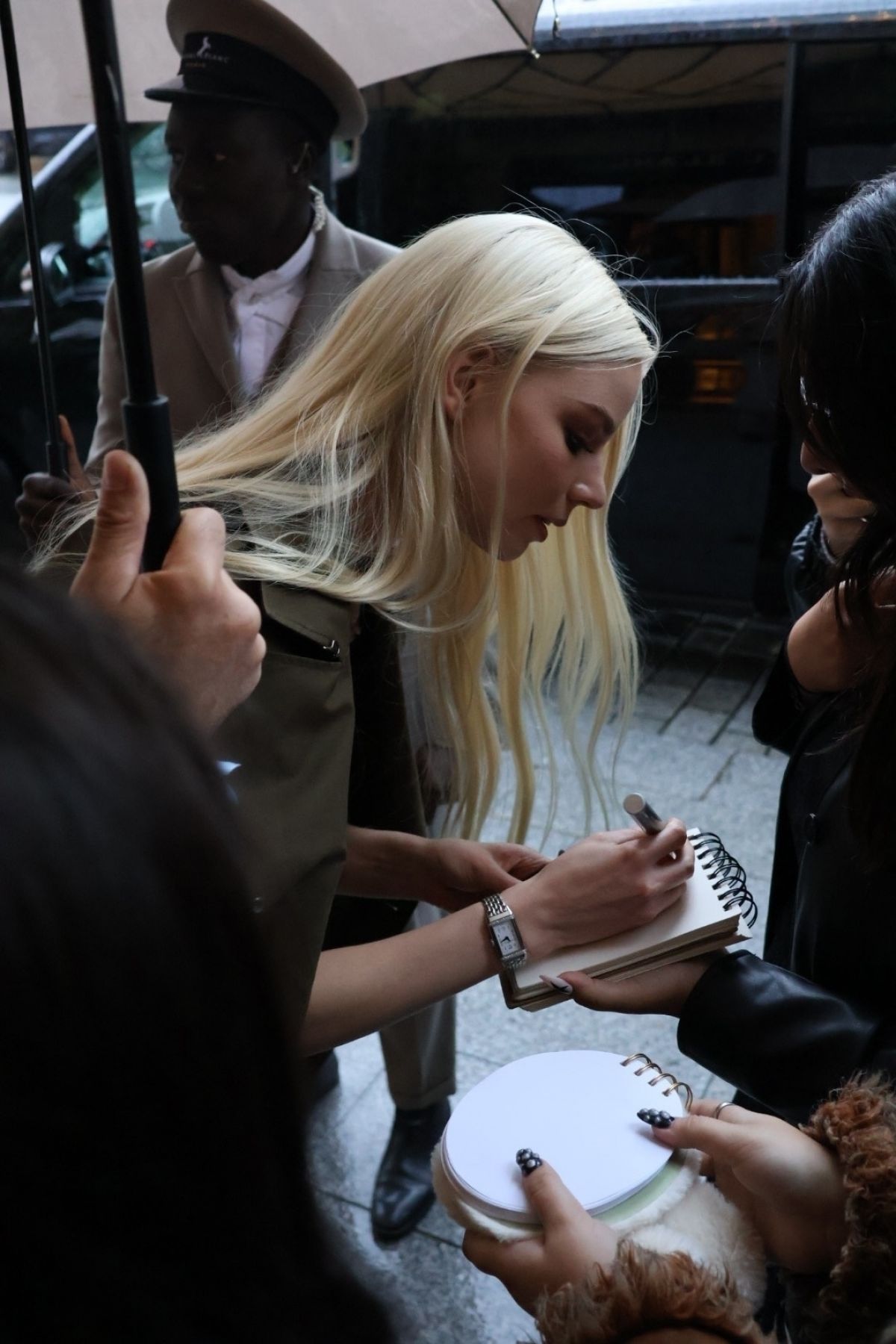 Anya Taylor Joy Taking Selfies with Fans at Paris Fashion Week