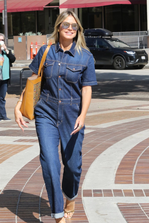 Heidi Klum in Denim Overalls Arrives at America