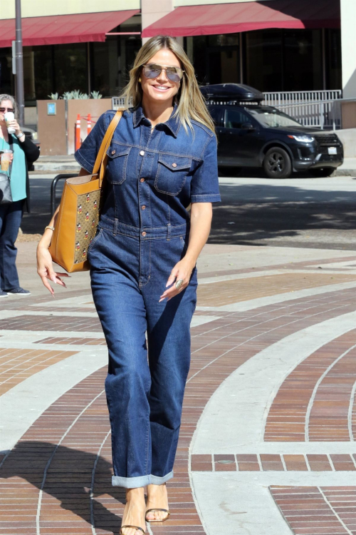 Heidi Klum in Denim Overalls Arrives at America