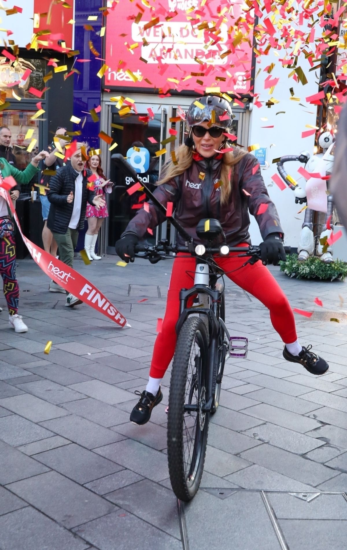 Amanda Holden Celebrates Cycle Challenge Completion in London, October 2024