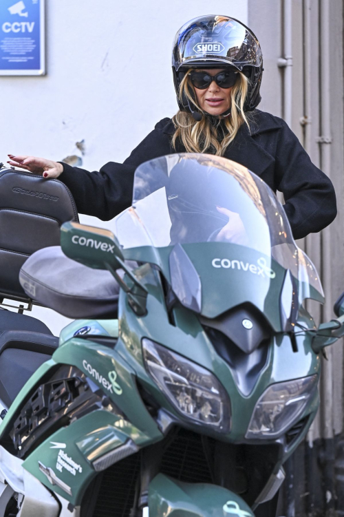 Amanda Holden Leaves Global Studios on a Motorcycle in London, October 2024