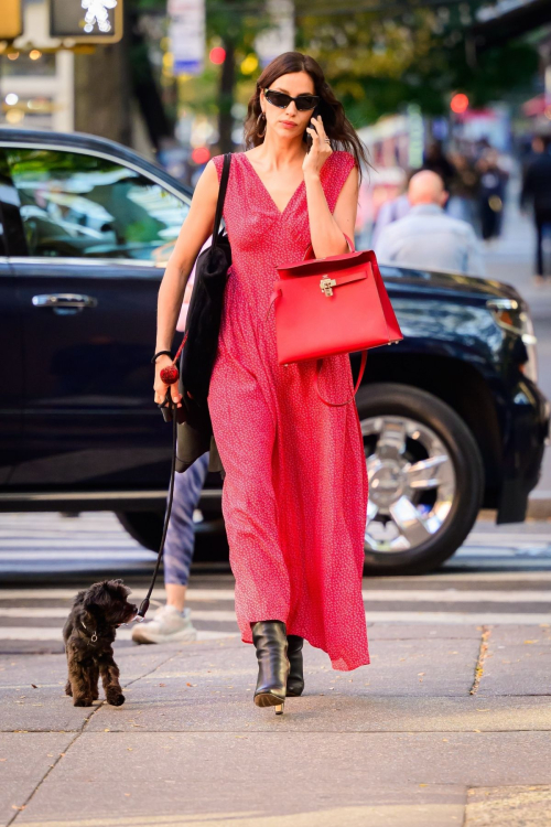 Irina Shayk in Red Dress Out with Dog in New York, October 2024