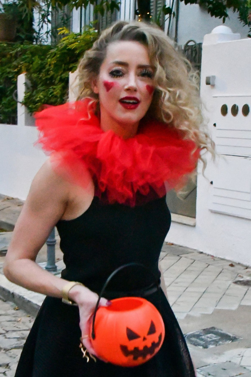 Amber Heard in Quirky Clown Makeup and Red Ruff Collar Celebrates Halloween, October 2024 1