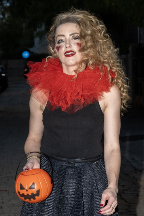 Amber Heard in Quirky Clown Makeup and Red Ruff Collar Celebrates Halloween, October 2024 3