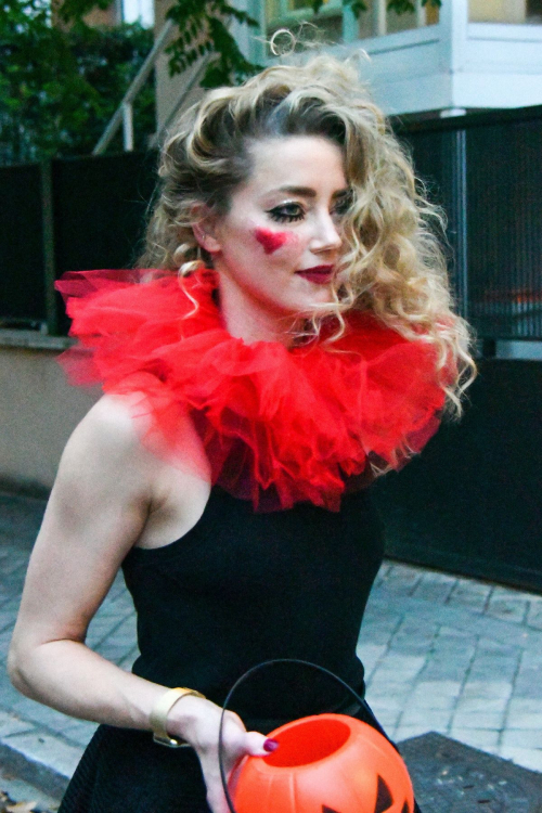 Amber Heard in Quirky Clown Makeup and Red Ruff Collar Celebrates Halloween, October 2024 5