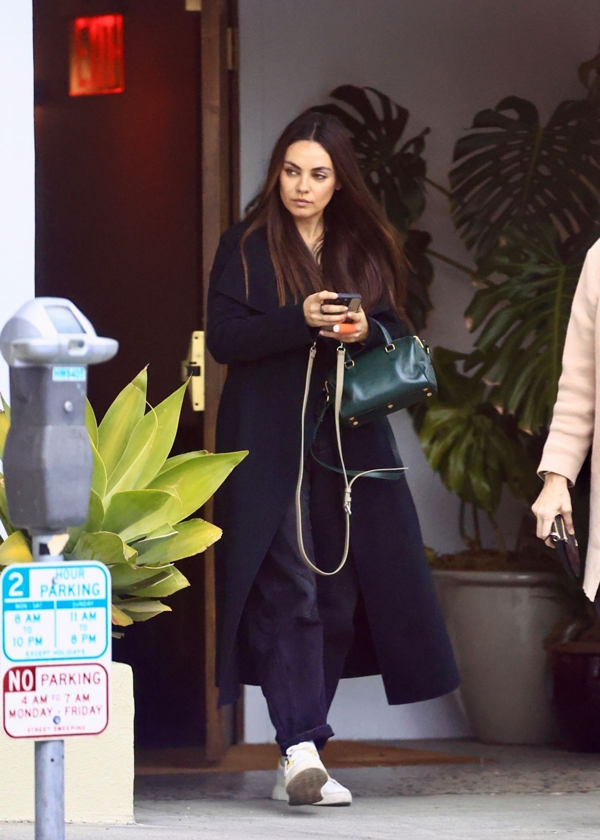 Mila Kunis Leaves a Restaurant in West Hollywood, December 2024