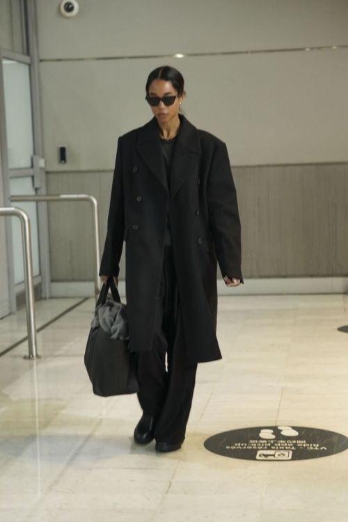 Laura Harrier Wows in Black Ensemble at Paris Airport, January 2025 2