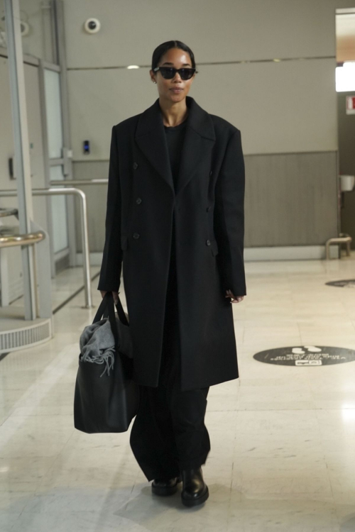 Laura Harrier Wows in Black Ensemble at Paris Airport, January 2025 4