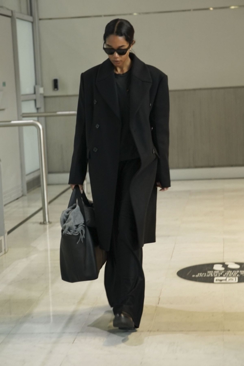 Laura Harrier Wows in Black Ensemble at Paris Airport, January 2025 6