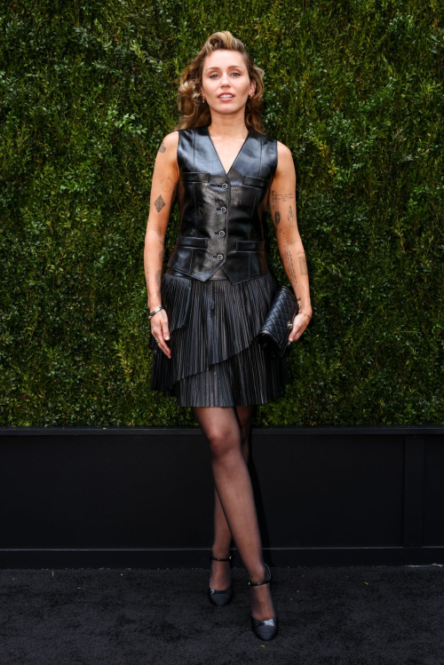 Miley Cyrus Rocks Black Leather Dress with Retro Waves