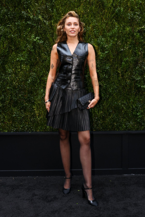 Miley Cyrus Rocks Black Leather Dress with Retro Waves 2