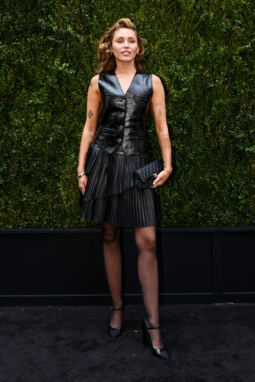 Miley Cyrus Rocks Black Leather Dress with Retro Waves 4