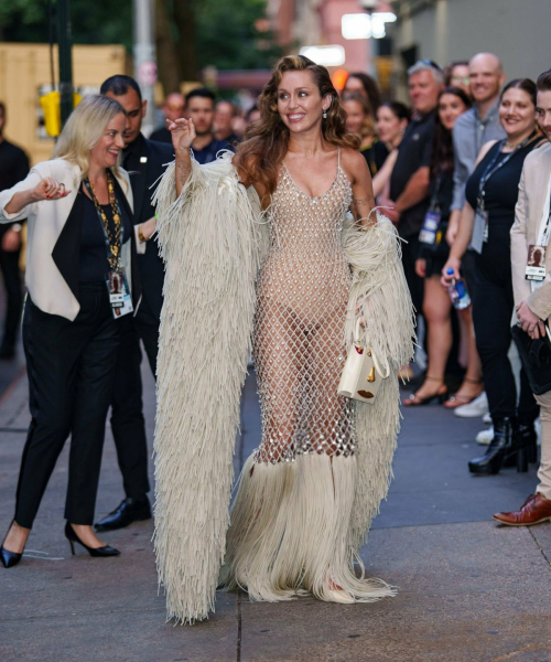 Miley Cyrus in fashion forward sheer cream mesh gown with textured fringe accents