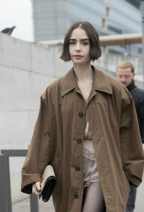 Lily Collins Arrives at Austerlitz Train Station Paris, December 2025