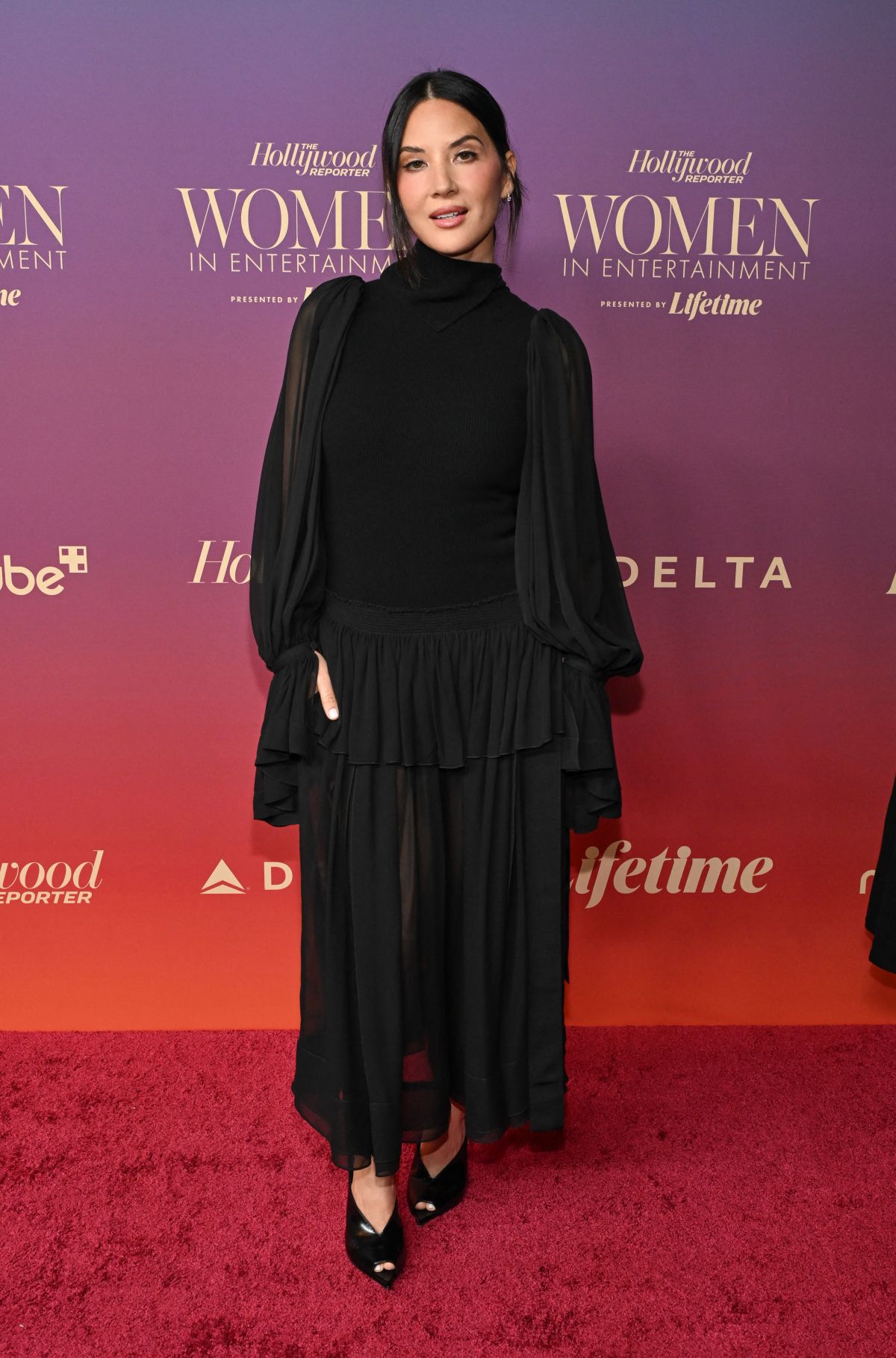 Olivia Munn at THR Women in Entertainment Gala, December 2025