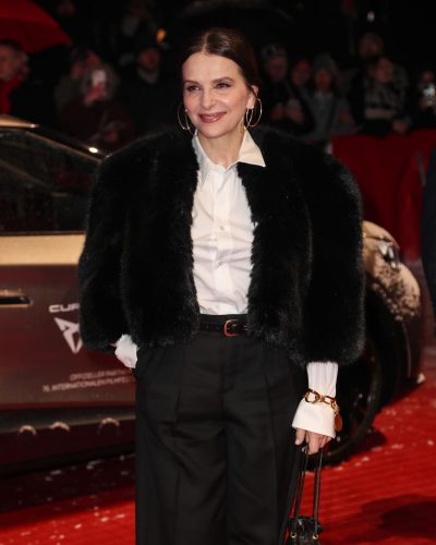 Juliette Binoche stuns in stylish look at premiere