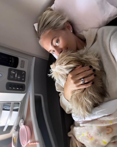 Alexa Serowik radiant orange dress complemented by delicate gold jewelry.