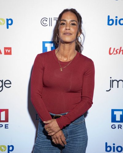 Alice Belaidi wearing high-waisted jeans paired with snug top