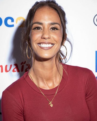 Alice Belaidi in a fitted top with high-waisted denim jeans