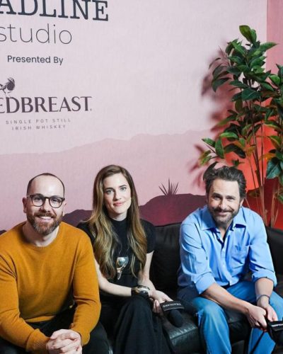Allison Williams in a tailored black gown with eye-catching metallic accents.