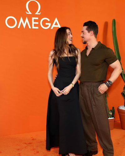 Allison Williams fitted black dress with polished accessories