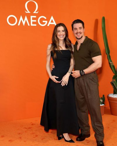 Allison Williams classic black dress complemented by silver bracelet