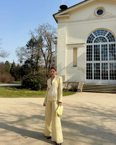 Anna Maria Olbrycht with relaxed posture in light blue denim outfit