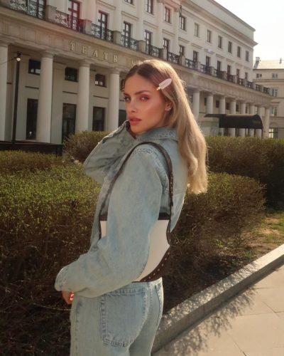 Anna Maria Olbrycht wearing elegant white heels and denim ensemble