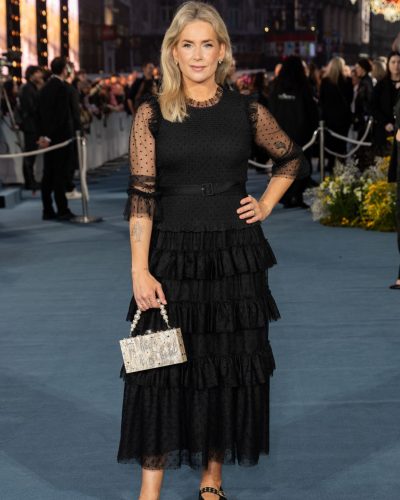 Anna Whitehouse chic silver handbag lined with gleaming pearls.