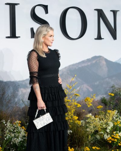 Anna Whitehouse black dress with sheer polka dot sleeves.