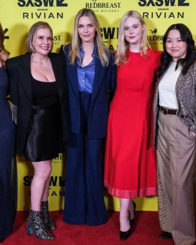 Annalise Basso in black dress with flowing sheer fabric