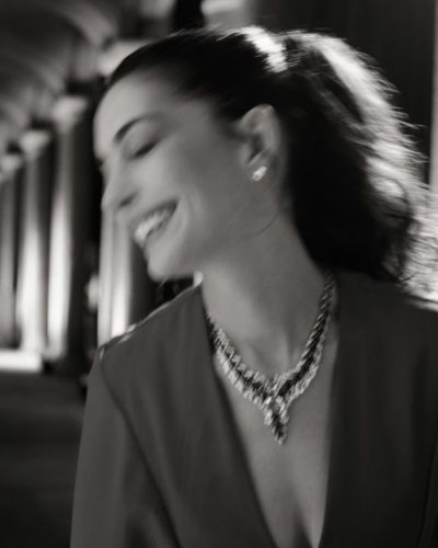 Anne Hathaway vibrant red dress with deep V-neckline