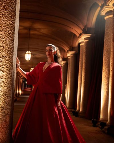 Anne Hathaway close-up of emerald and diamond necklace