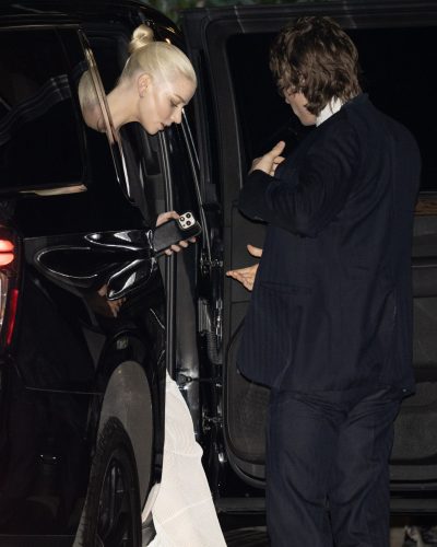 Anya Taylor-Joy chic hairstyle complementing her dress