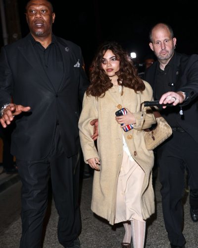 Ariana Greenblatt wearing a chic black dress with modern cut.