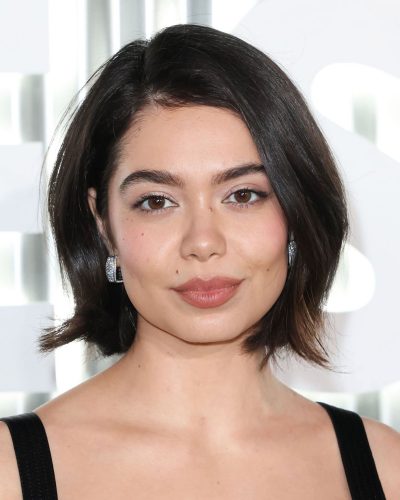 Auli’i Carvalho styles black velvet dress with minimal accessories