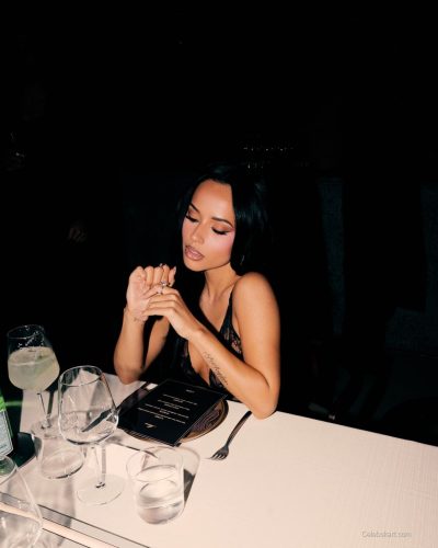 Becky G unique textures in high-waisted white pants