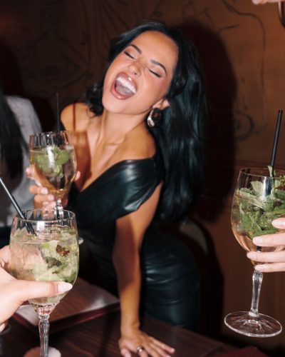 Becky G glamorous metallic top creating visual contrast