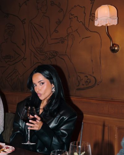 Becky G stylish high-waisted pants complementing metallic top