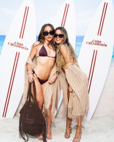 Brielle Biermann wearing playful accessories and beach attire.