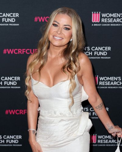 Carmen Electra white evening dress with asymmetrical flowing train