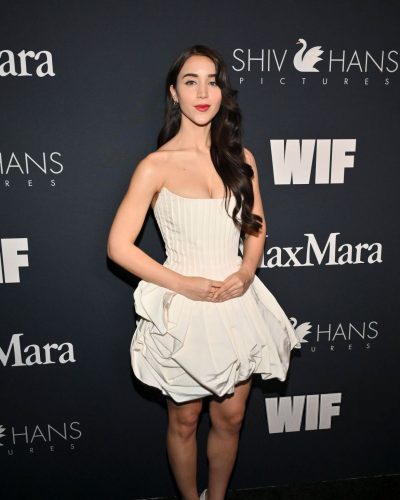 Caylee Cowan accessorized with a minimalist clutch bag.