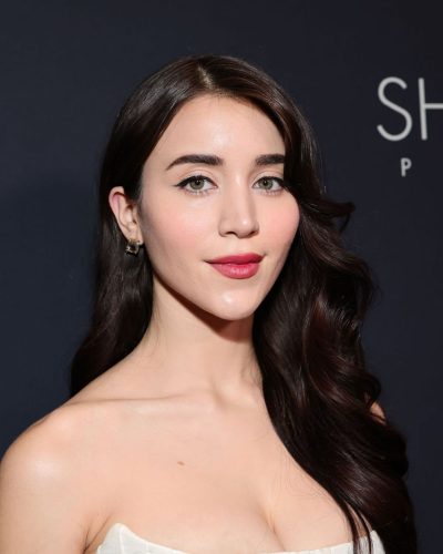 Caylee Cowan in a modern white dress with structured design.